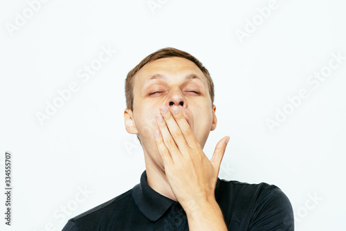 Yawns. Man
