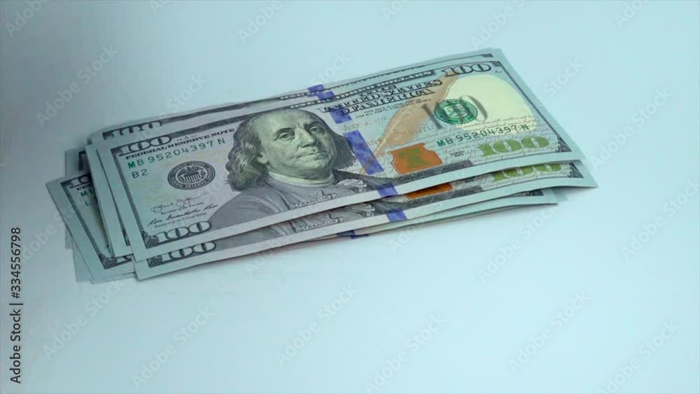 counting one hundred dollar banknotes counting one hundred dollar banknotes