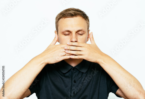 man closes a mouth hands