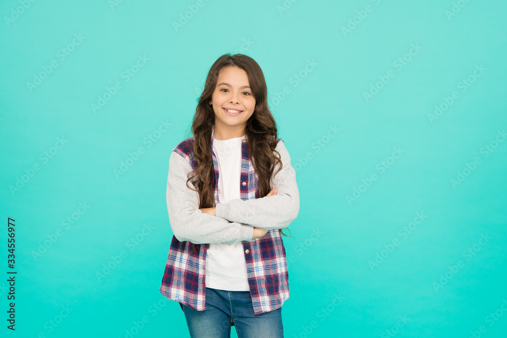 Living happy life. Good mood concept. Positive vibes. Sincere emotions. Cute girl with long hair. Small girl checkered shirt. Happy international childrens day. Little girl turquoise background Living happy life. Good mood concept. Positive vibes. Sincere emotions. Cute girl with long hair. Small girl checkered shirt. Happy international childrens day. Little girl turquoise background