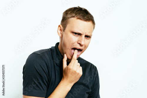 male of European appearance causes vomiting putting his fingers in his mouth on a , nausea