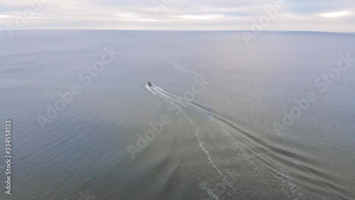Aerial view of boat driving into the sea