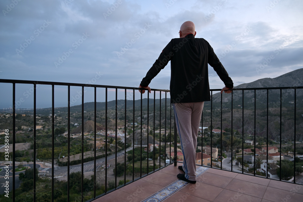 An elderly man in corona house arrest on his balcony in Finestrat Spain.