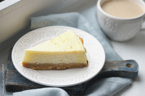 Serving of cheesecake on a white saucer