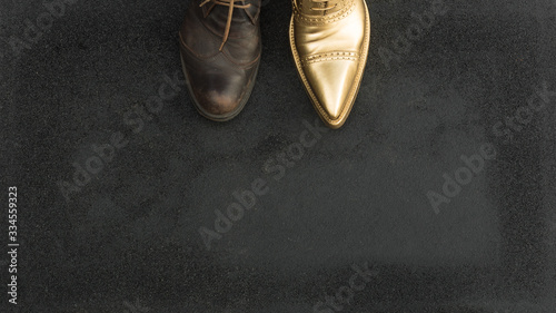 Obraz na plátně concept of rich and poor in a shoes, old and golden shoe