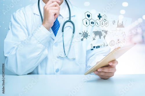 Close up of Doctor is showing medical analytics data of Coronavirus (Covid-19), Medical technology concept