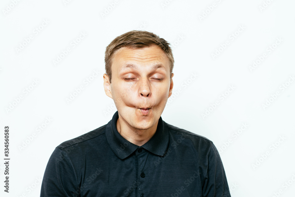 Man sucks his cheeks Man sucks his cheeks