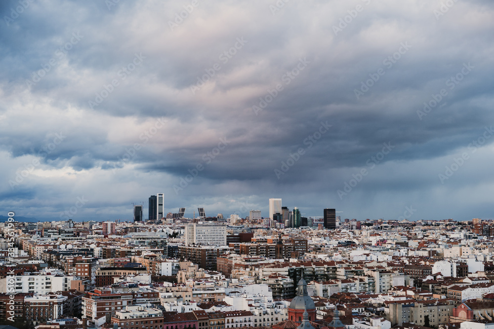 Aerial view of the city of Madrid including the business and financial district. Cloudy sky