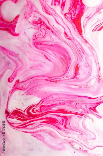 Abstract background of mixed shades of nail polish with a marble