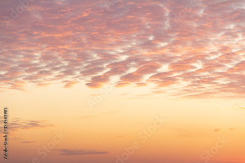 cirrus clouds on a peach sky