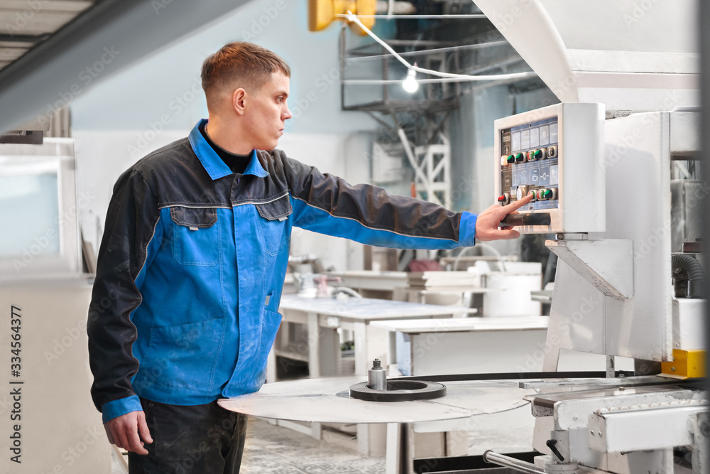 Engineer worker presses a button on the control panel. Concept automated manufacturing factory, modern production technologies Engineer worker presses a button on the control panel. Concept automated manufacturing factory, modern production technologies