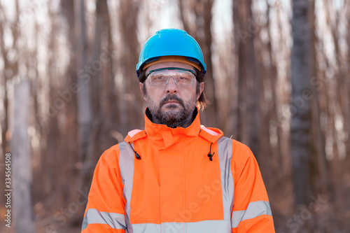 Forestry technician in forest, portrait of tree nursery professional