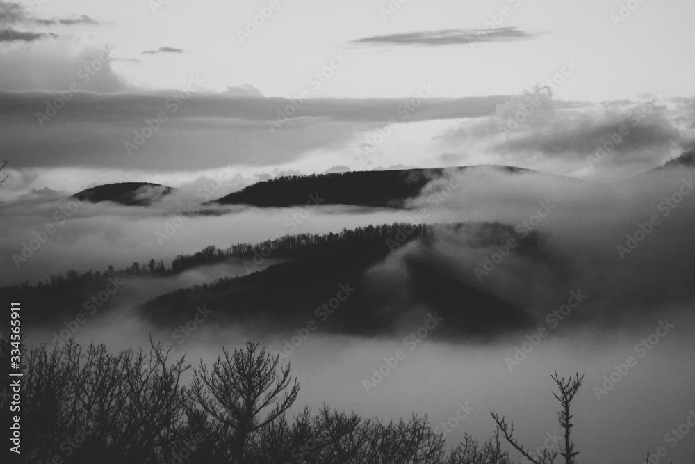 Fototapeta premium Rolling fog over mountains