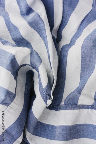 White fabric with blue stripes close up