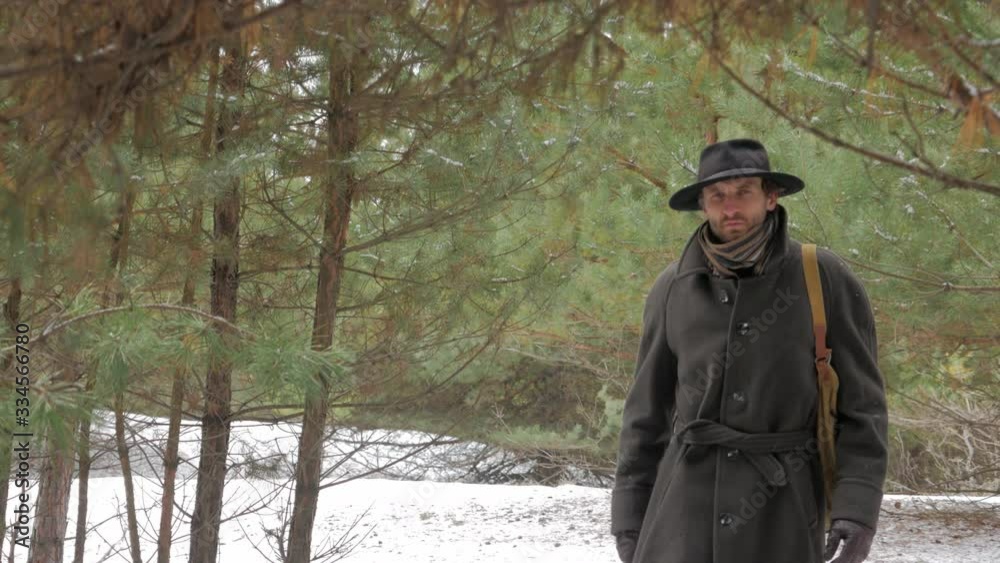 hunter walking in the winter woods hunter walking in the winter woods