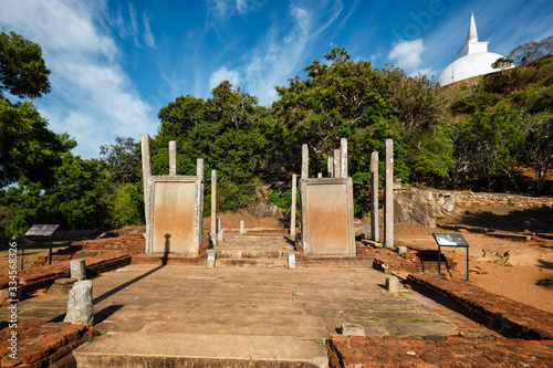 Relic house with Mihintale tablets, Mihintale, Sri Lanka. Ancient ruins pillars with inscriptions at Mahaseya Dagoba Buddhist monastery. photo