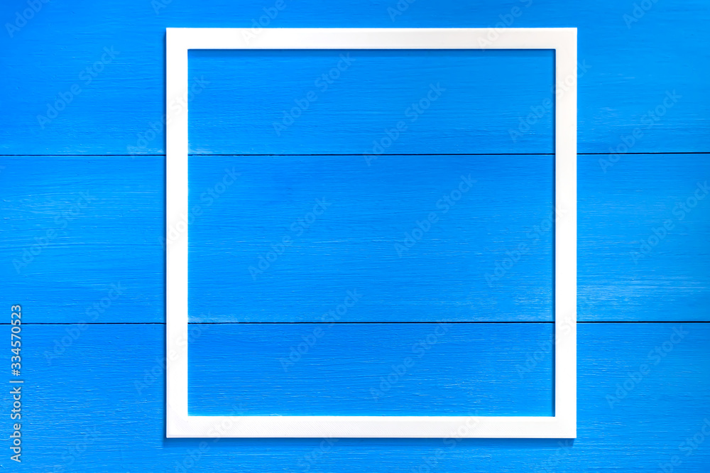 wooden frame on a blue background. blank photo frame isolate.