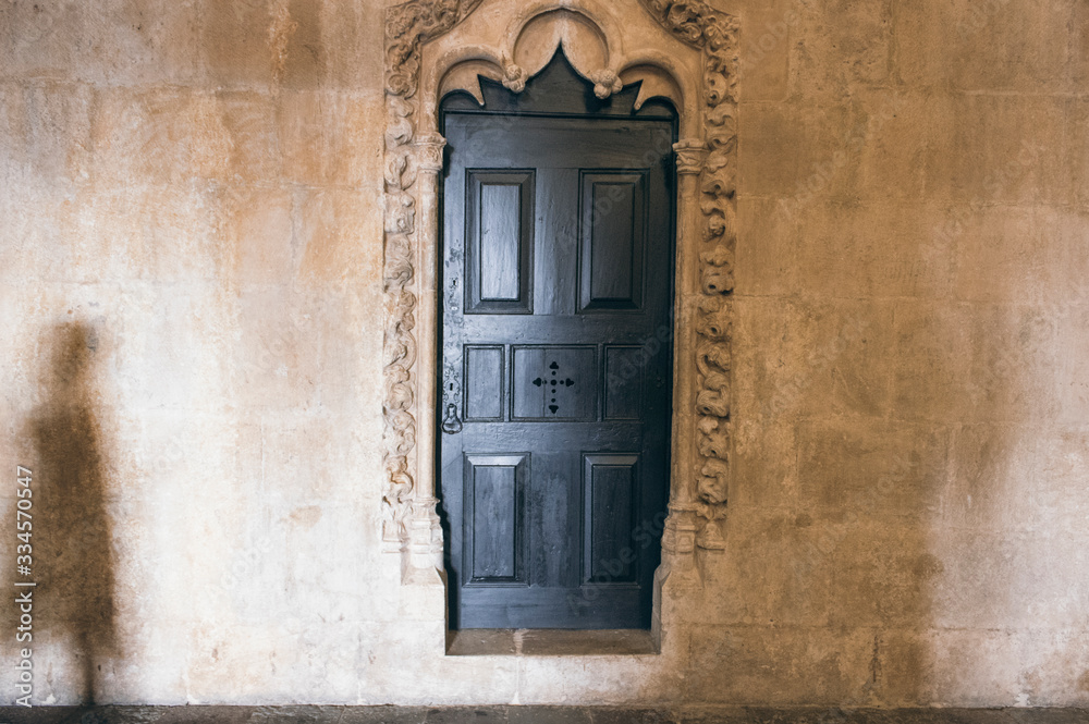 A shadow next to a door in a monastery in Lisbon