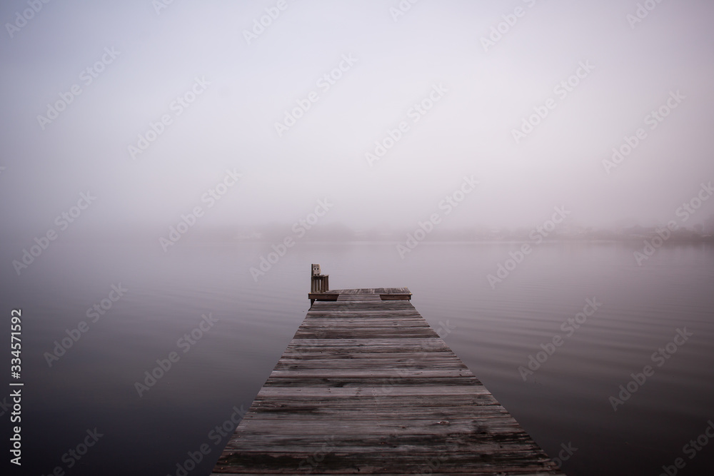 Fototapeta Dock on the lake in fog
