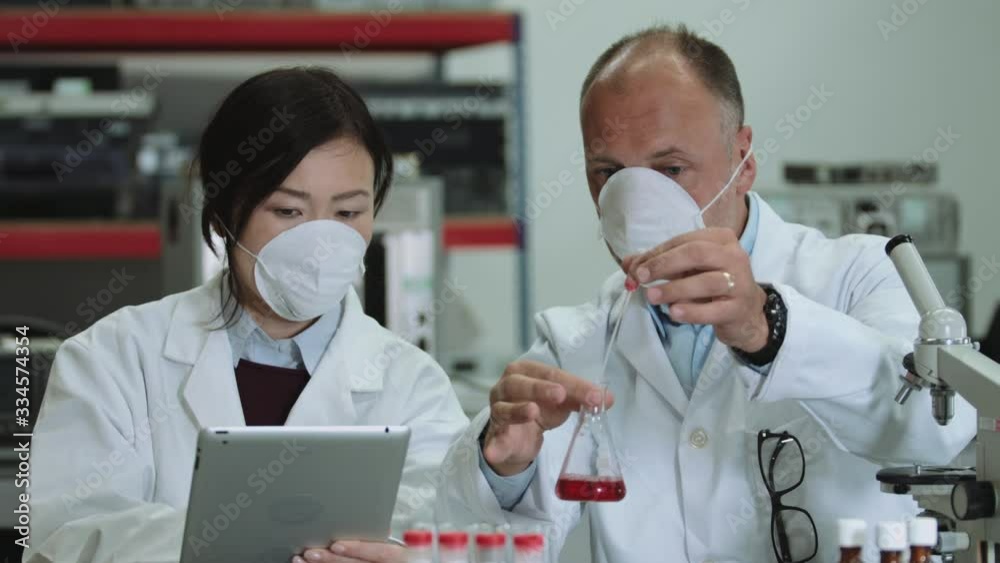 Scientist team working in laboratory Scientist team working in laboratory