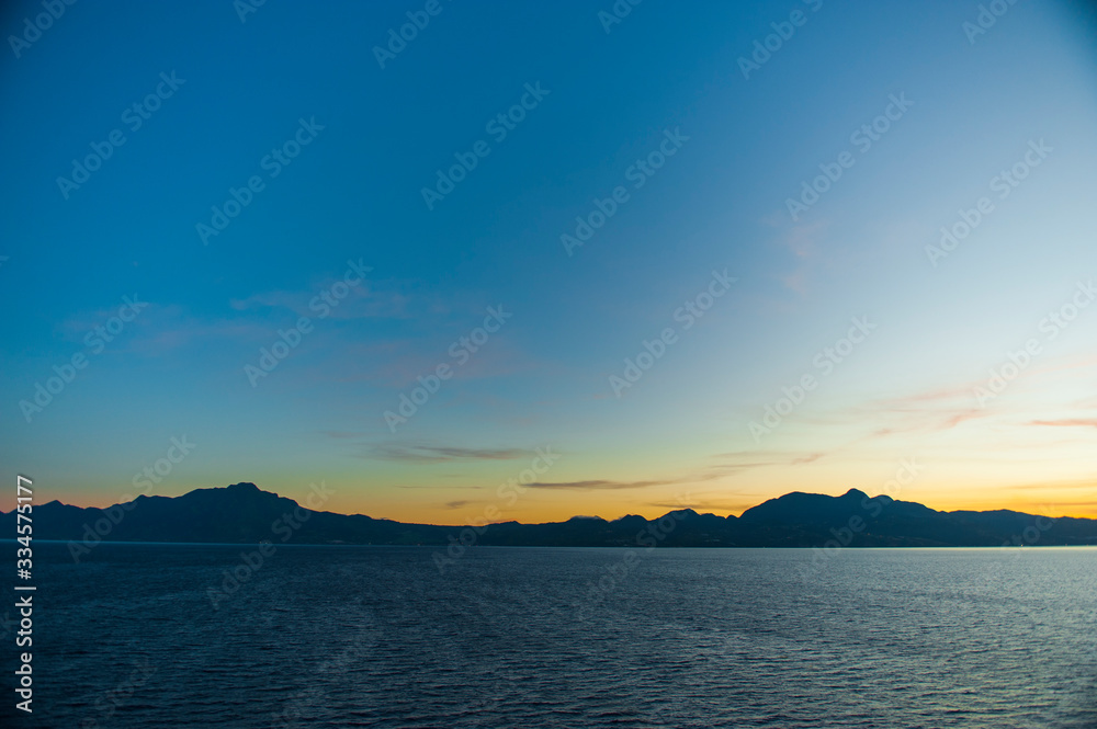 Distant Caribbean Islands from a Cruise ship by sunset
