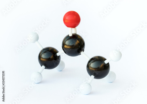 Ball-and-stick-model of an acetone molecule (chemical formula (CH3)2CO) on a white background. Acetone is the smallest ketone and is commonly used as a solvent. photo