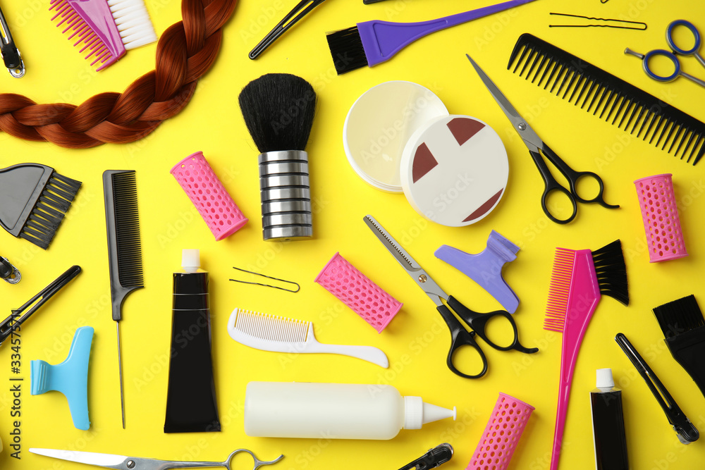 Professional tools for hair dyeing on yellow background, flat lay Professional tools for hair dyeing on yellow background, flat lay