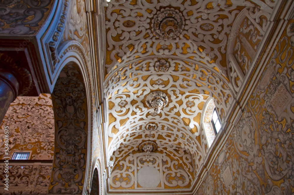 Decorated church ceiling, white and gold. Seville, Spain