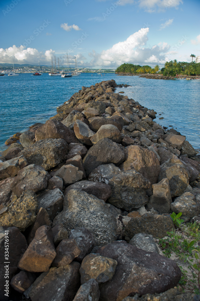 Rocky pier on a tropical caribbean island