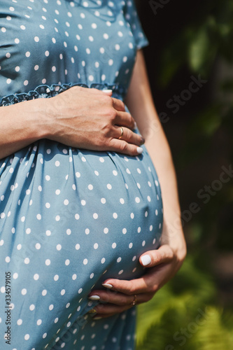 pregnant girl holds belly with hands © Иван Полубятко