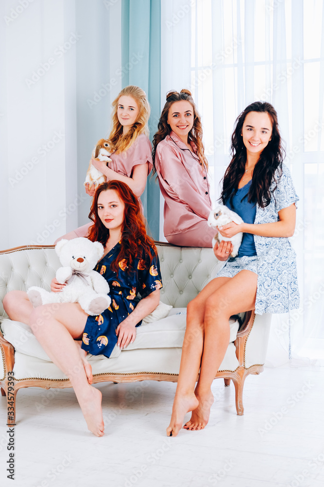 Group of girls playing with pets Group of girls playing with pets