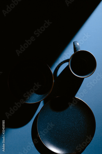 Overhead view of cup, bowl and saucer on table