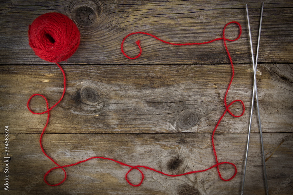 a ball of yarn on a wooden background
