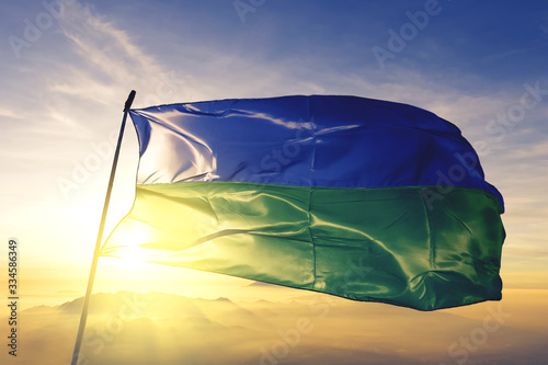 Soledad of Colombia flag waving on the top sunrise mist fog