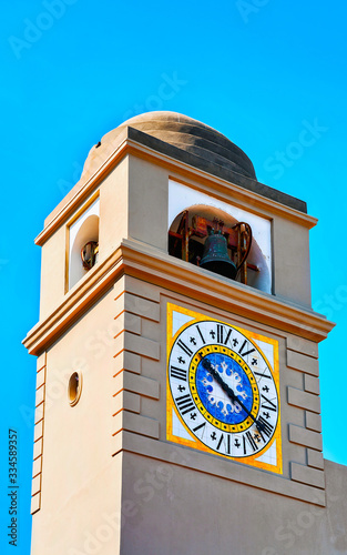 Clock tower of Church of Santo Stefano on Capri Island reflex photo