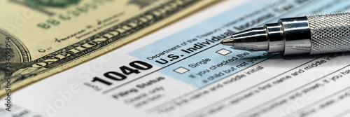 Detail closeup of current tax forms for IRS filing. Tax time