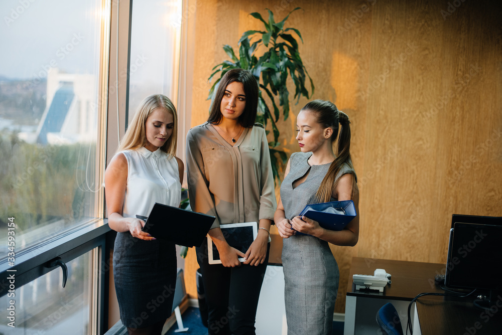 The staff in the office to discuss business matters next to the window. Business, Finance The staff in the office to discuss business matters next to the window. Business, Finance