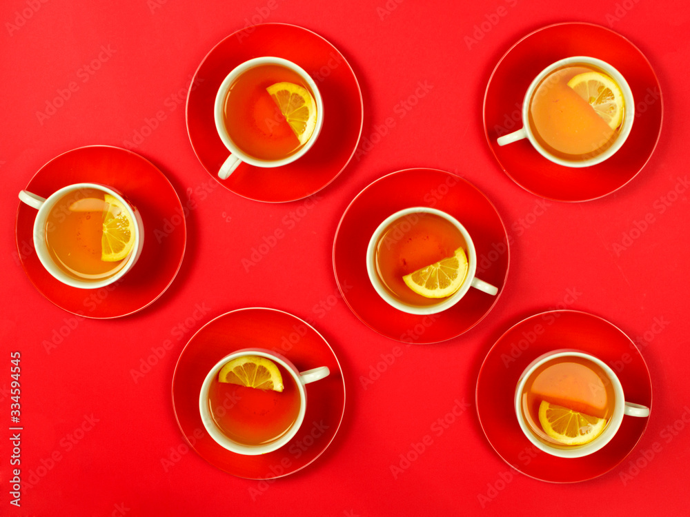 cups and saucers, lemon tea, place for text, top view, warming vitamin drink