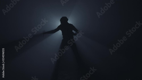 Killer with a knife in dark