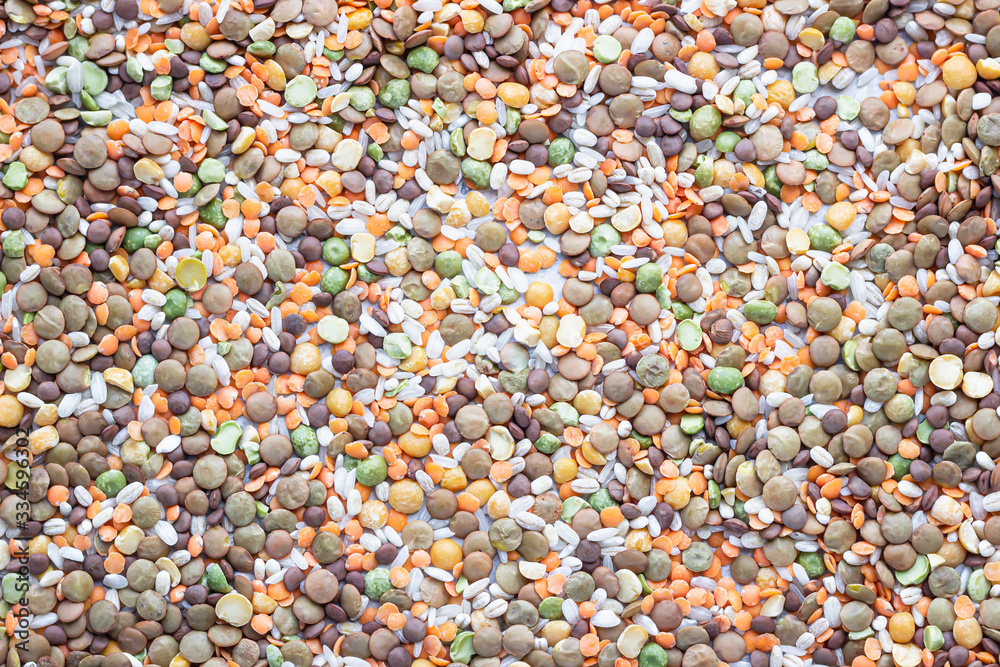 Flat lay composition with different types of grains and cereals on light grey concrete background. Food ingredients and agricultural product concept.