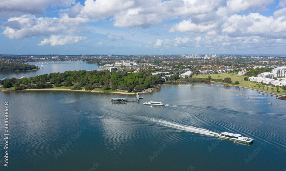 Aerial view of the Parramatta river ferry passing Cabarita park, Sydney, Australia.
