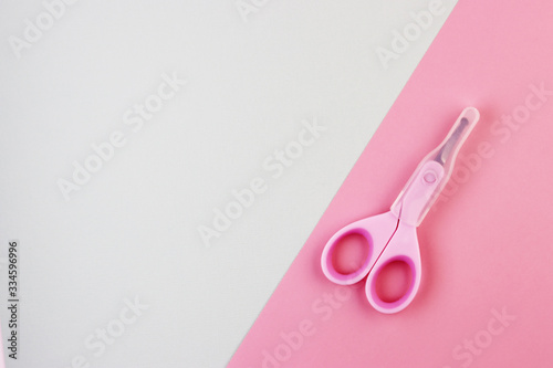 small pink closed scissors for baby care