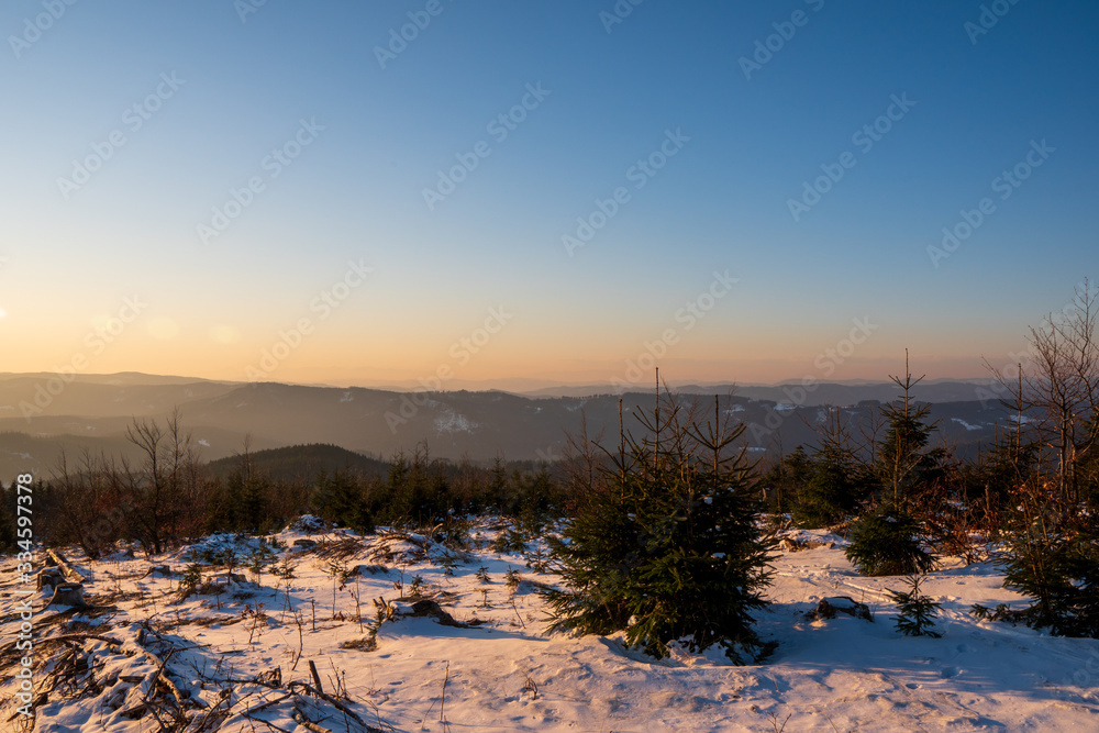 Gorgeous winter landscape with mountains in the background early morning, Czech