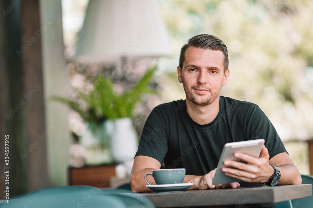 Young man with laptop works from home Young man with laptop works from home