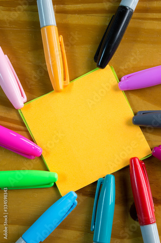 Colored markers with a notepad