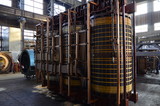High-voltage three-phase transformer during overhaul at the factory. Winding transformer