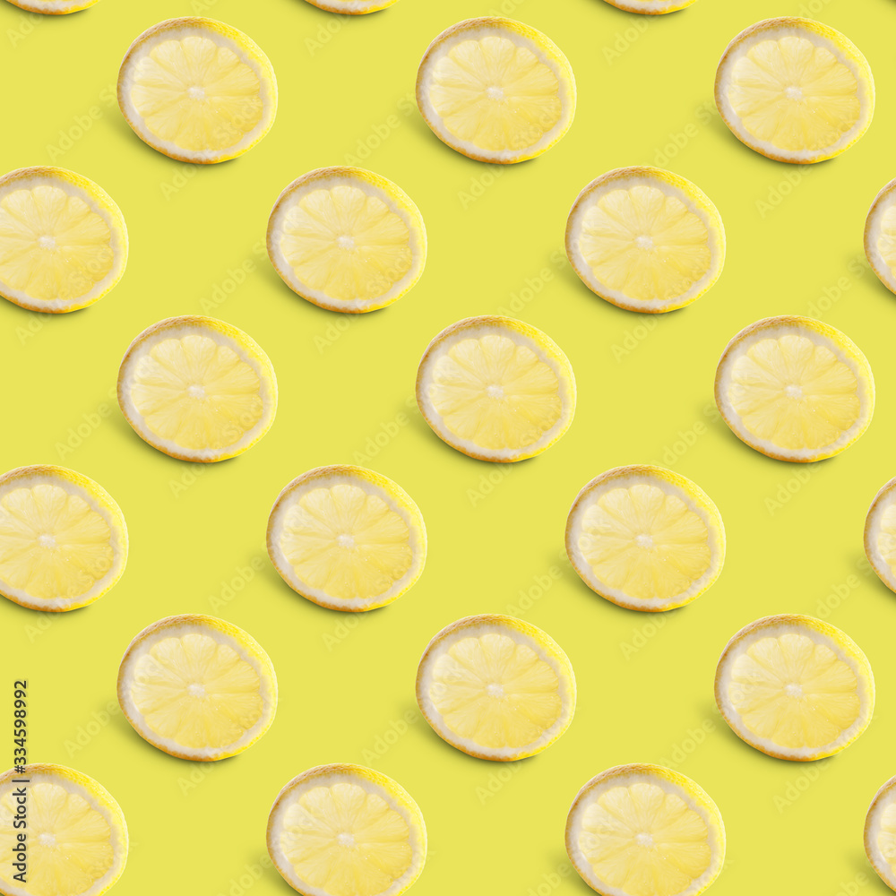 Seamless pattern of lemon slices on blue background. Food texture