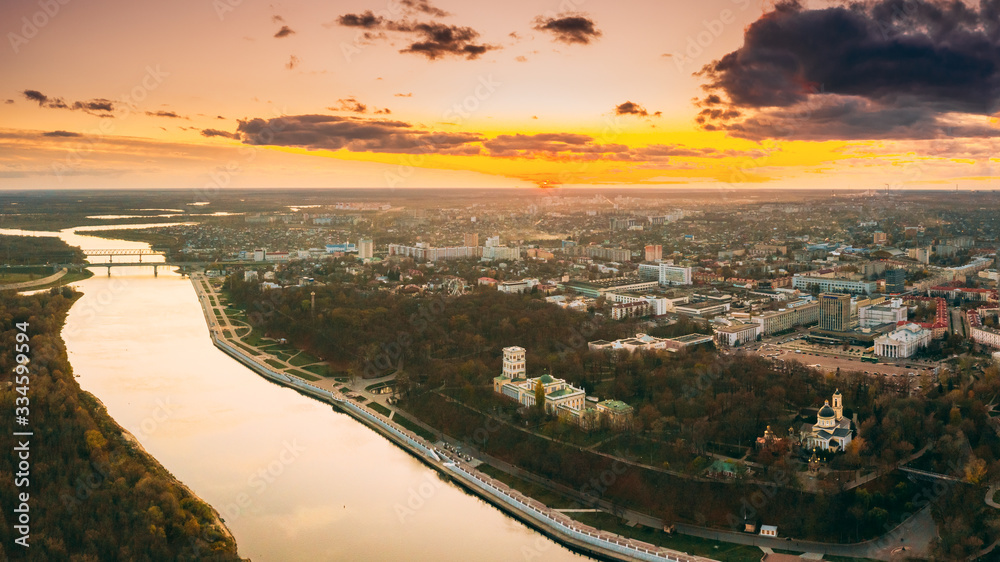 Gomel, Belarus. Aerial View Of City Park Paskeviches Palace And Homiel Cityscape Skyline In Autumn Evening. Residential District And River During Sunset. Bird's-eye View