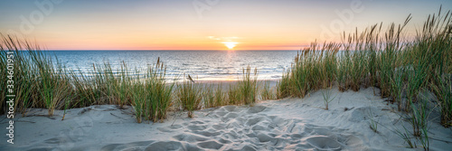 Billede på lærred Sunset at the dune beach