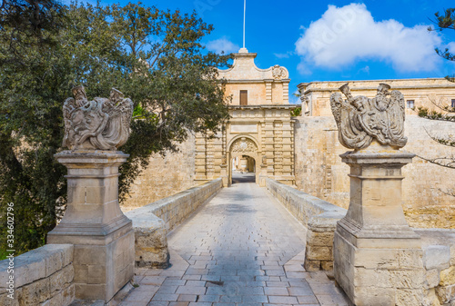 City gate to the Mdina city - old capital of Malta country. No people, empty bridge 
